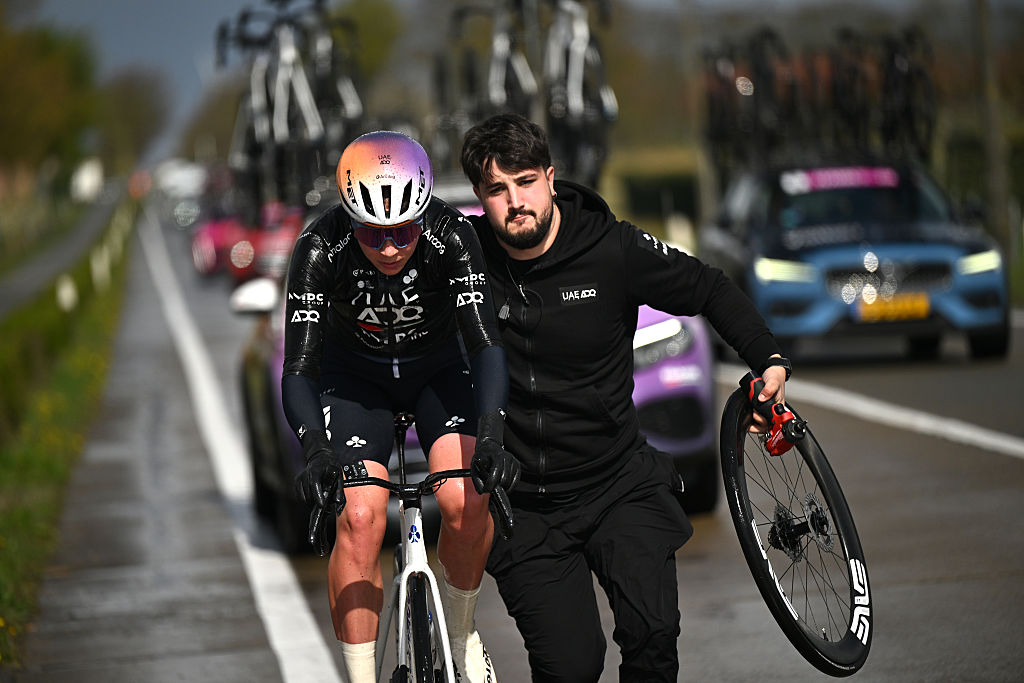 BRUGES, BELGIUM - MARCH 26: Sofie van Rooijen of Netherlands and UAE Team ADQ assisted by the team car during the 9th Ronde van Brugge - Tour of Bruges 2026, Women's Elite a 143.7km one day race from Bruges to Bruges on March 26, 2026 in Bruges, Belgium. (Photo by Luc Claessen/Getty Images)