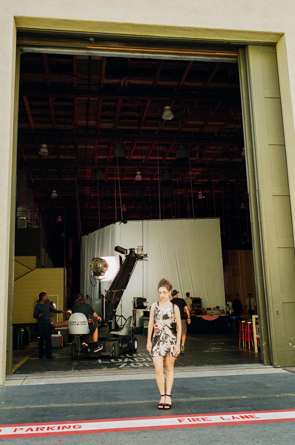 Rachel Sennot on the set of I Love LA wearing a vintage Dior dress