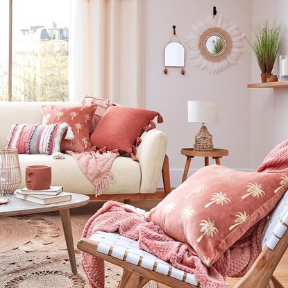 room with sofa and cane lamp