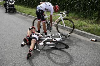 Alberto Contador and teammate Michael Gogl are pictured after falling during the 203,5km 11th stage of the Tour de France