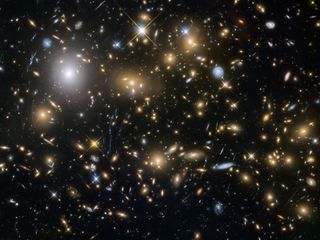 This image from the NASA/ESA Hubble Space Telescope shows the galaxy cluster MACSJ0717.5+3745. This is one of six being studied by the Hubble Frontier Fields programme, which together have produced the deepest images of gravitational lensing ever made. Image released Oct. 22, 2015.