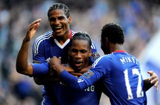 Didier Drogba celebrates with Chelsea team-mates after scoring against West Brom in August 2010.