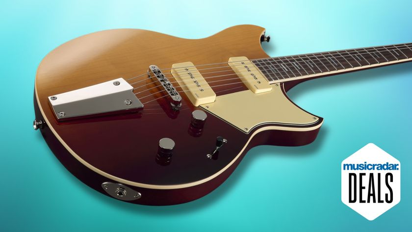 A Yamaha Revstar electric guitar on a blue background