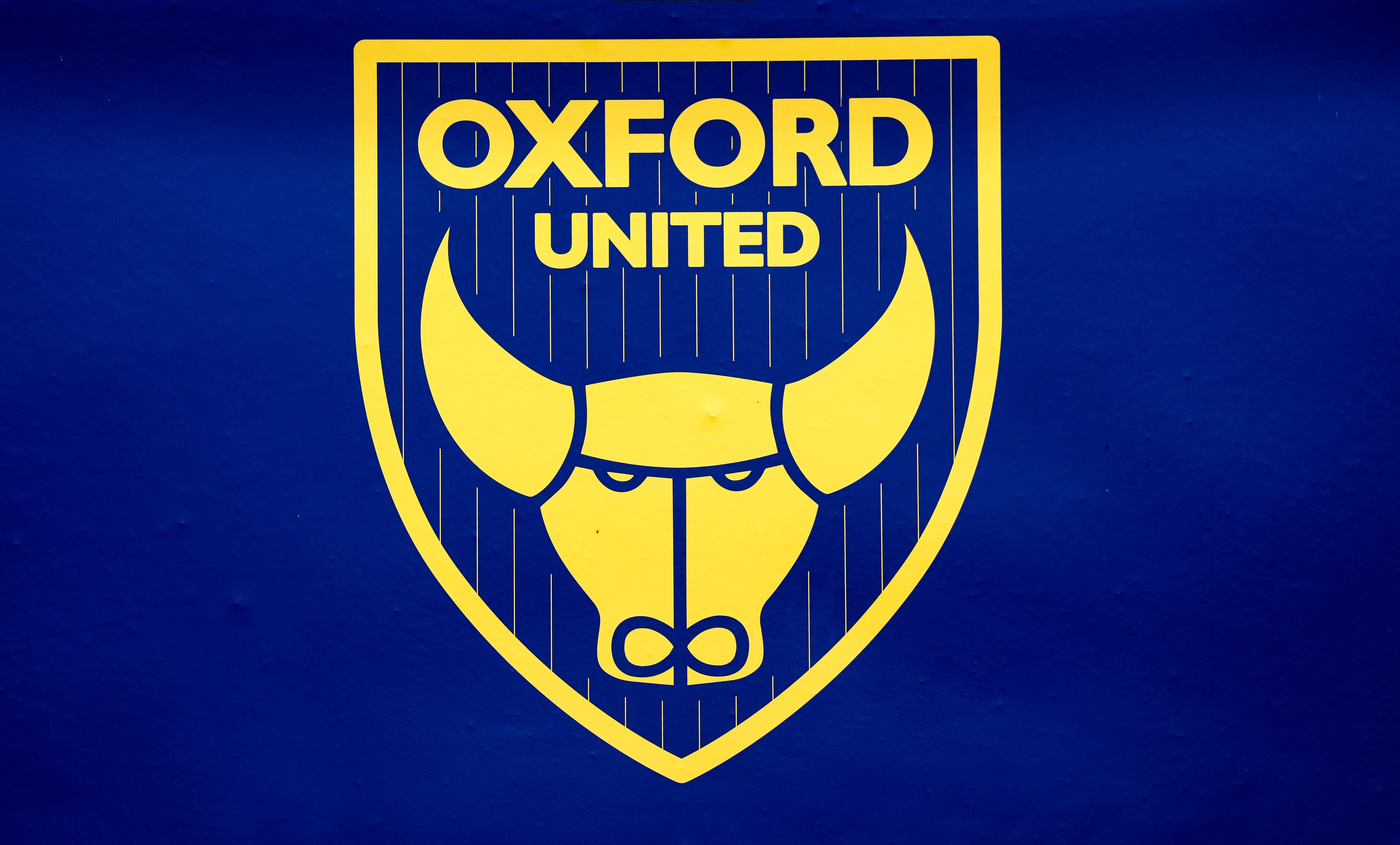 The Oxford United badge in yellow on a dark blue background