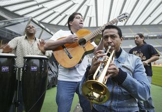 Former Newcastle United midfielder Nolberto Solano (right) playing the trumpet with his salsa band at St. James' Park in November 2005.