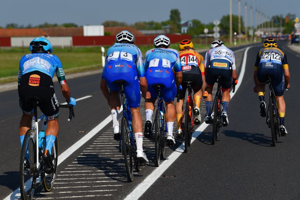 HAJDSZOBOSZL HUNGARY MAY 12 Aaron Van Poucke of Belgium and Team Sport Vlaanderen Baloise Red Mountain Jersey Jack Bauer of New Zealand Dylan Groenewegen of Netherlands and Team BikeExchange Jayco Lars Saugstad of Norway and Uno X Pro Cycling Team Simon Pellaud of Switzerland and Trek Segafredo Andrea Peron of Italy and Team Novo Nordisk and Diego Pablo Sevilla of Spain and EoloKometa Cycling Team dropped from the Peloton during the 43rd Tour de Hongrie 2022 Stage 2 a 192km stage from Karcag to Hajdszoboszl tourdehongrie on May 12 2022 in Hajdszoboszl Hungary Photo by Dario BelingheriGetty Images