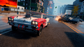 An official screenshot of Wreckreation 2, showing a classic red and white muscle car racing through a city street as a car spins out behind it.