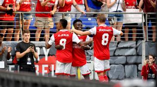BALTIMORE, MD - JULY 16: Arsenal forward Bukayo Saka (7) celebrates with forward Gabriel Jesus (9) and midfielder Martin Odegaard (8) after his first half goal during The Charm City Match between Arsenal and Everton at M&T Bank Stadium on July 16, 2022 in Baltimore, MD. (Photo by Randy Litzinger/Icon Sportswire via Getty Images)