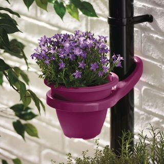 plant pot attached to black pipe