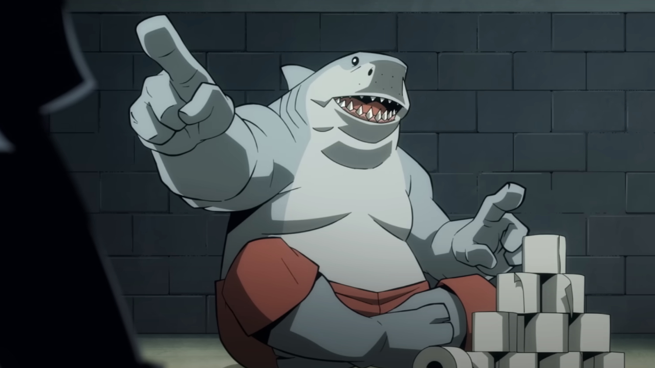 King Shark points and stacks toilet paper rolls in Creature Commandos