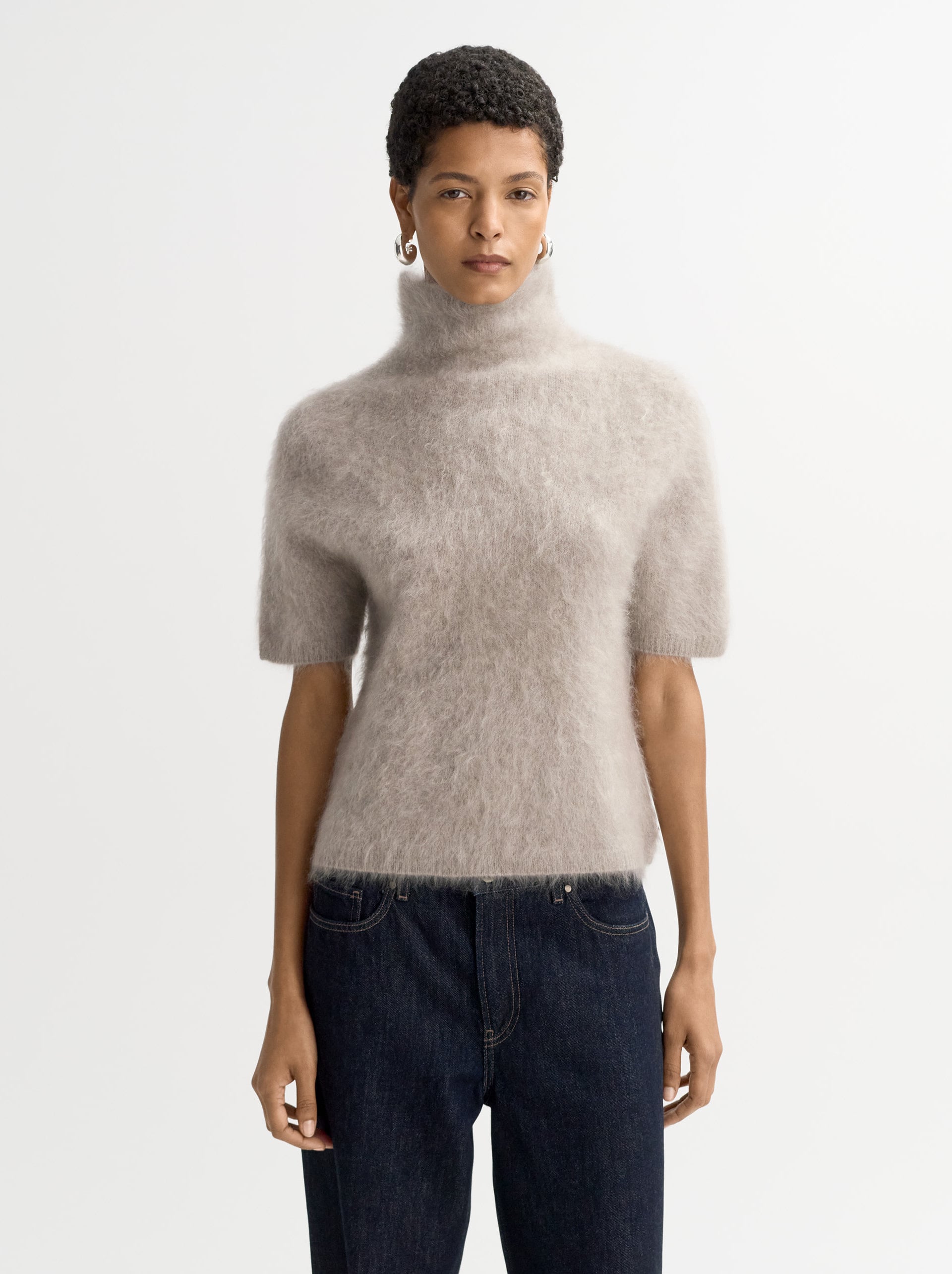 a model wearing a brushed cashmere soft goat jumper
