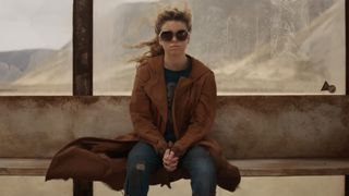 Kara Zor-El (Milly Alcock) waits for a transport ship in Supergirl.