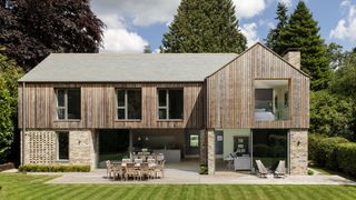 timber and brick clad house with large sliding doors