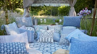 Garden party with floor cushions and rugs