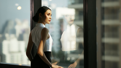 Woman Looking Out of Window