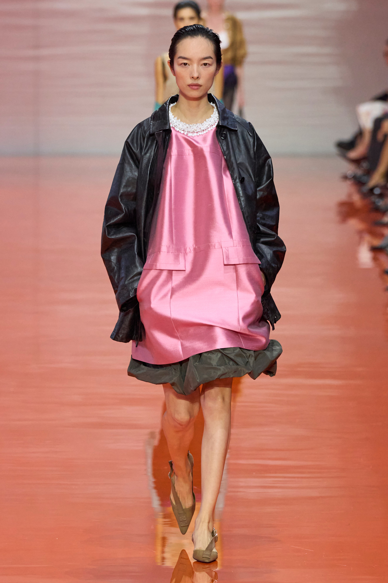 a model walking the runway at Prada