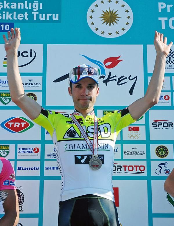 Giovanni Visconti (ISD - Neri) celebrates his stage win on the podium.