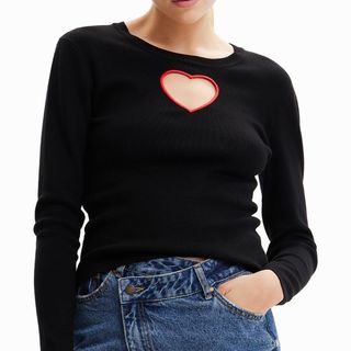 model wearing black desigual long sleeved top with heart shape cutout