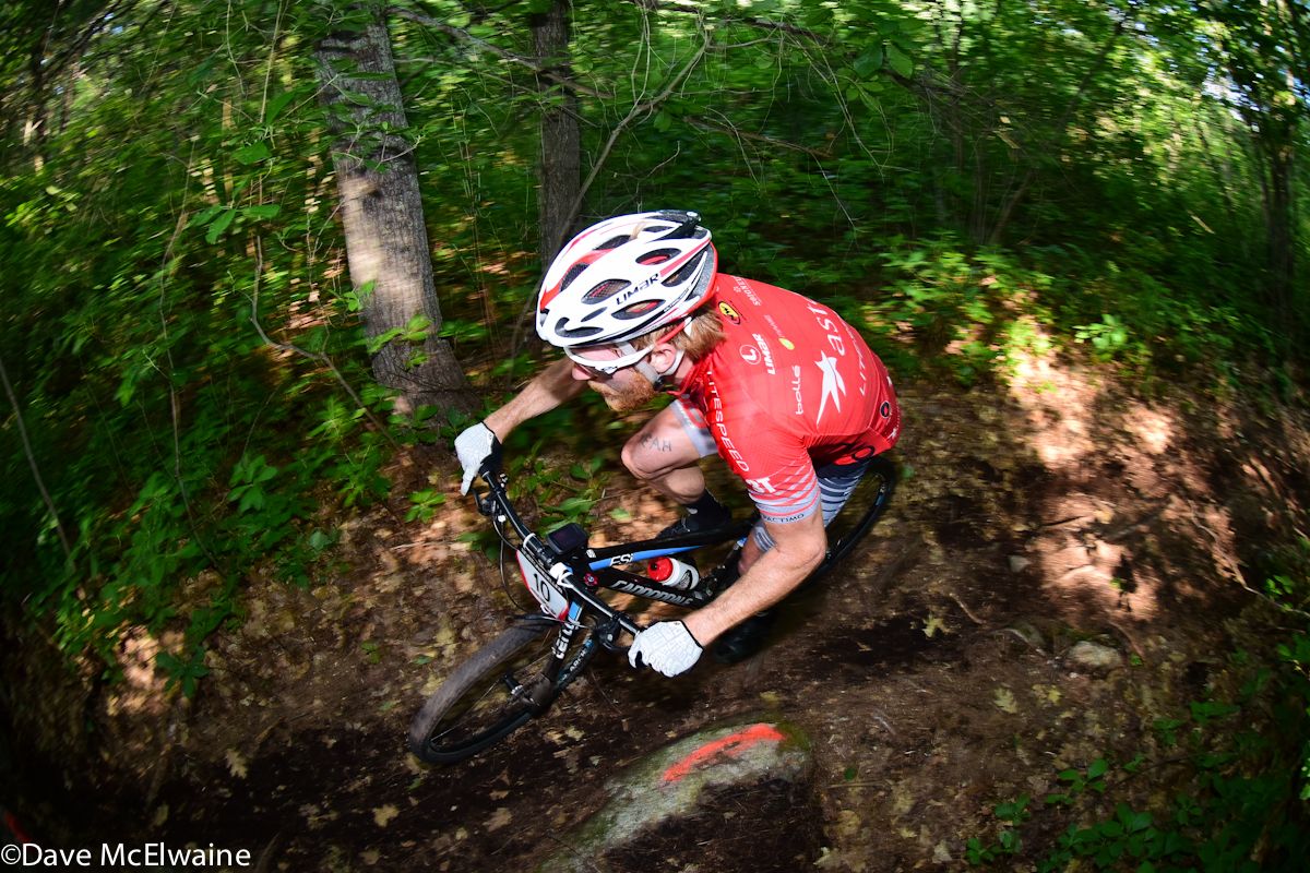 Stephen Hyde (Astellas Pro Cycling) riding in the lush forest at Walpole, Massachusetts