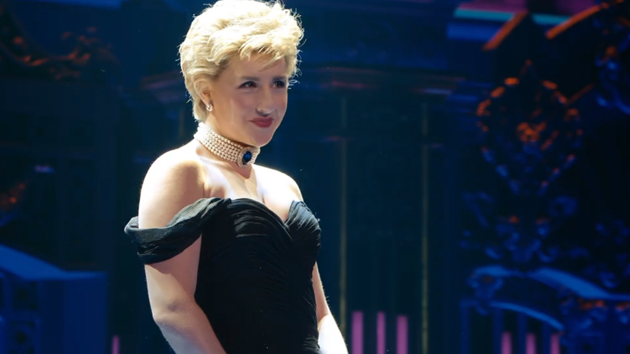 An actress in a black dress as Princess Diana in Diana the musical on Netflix.