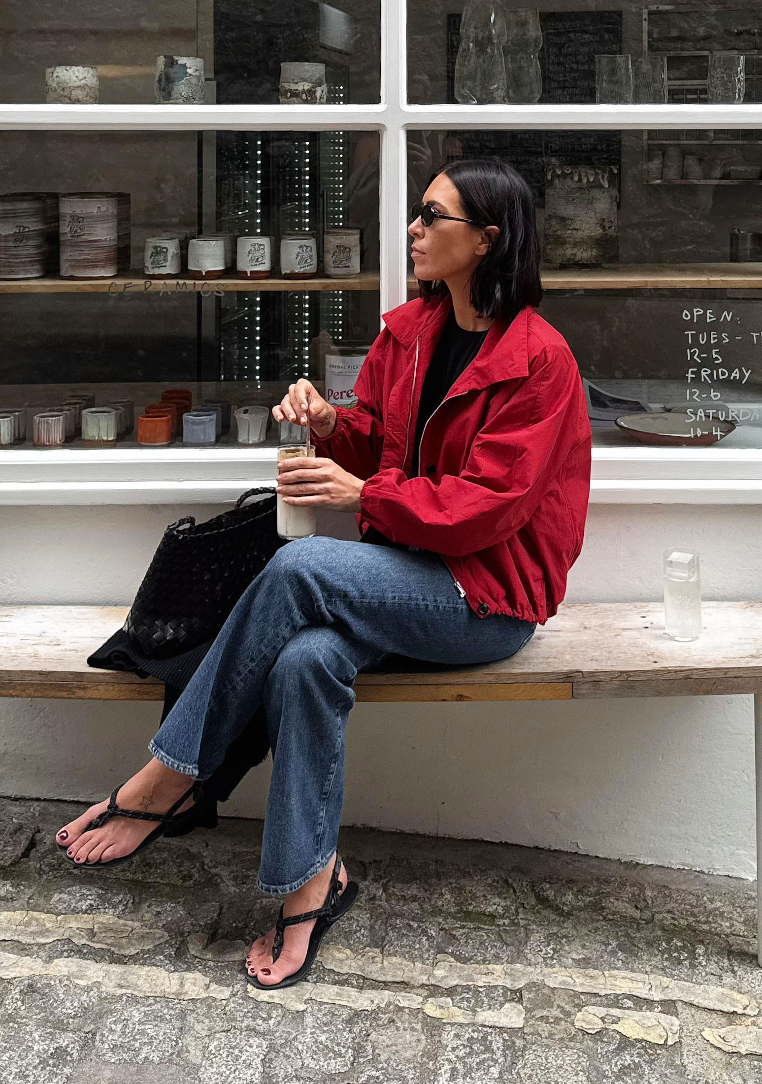 Woman in a red jacket with jeans