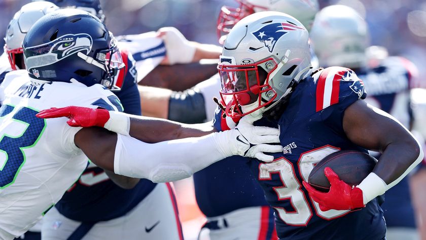 Players of the Seattle Seahawks and New England Patriots battle things out.