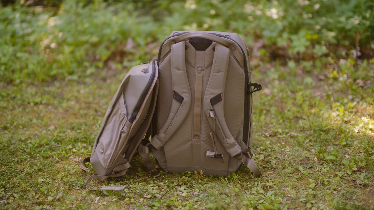 The Peak Design Travel 2-in-1 Backpack outdoors used by a photographer