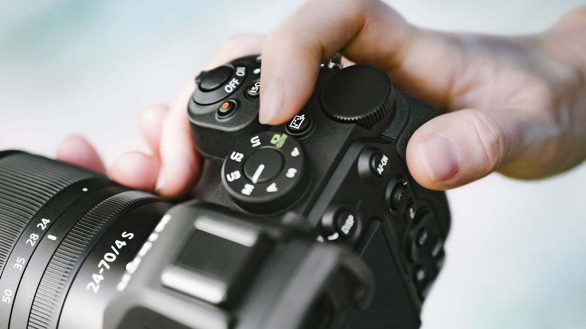 Close up of the Nikon Z5 II camera's picture control button in use