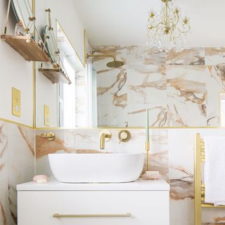 marble and white bathroom with bath and basin