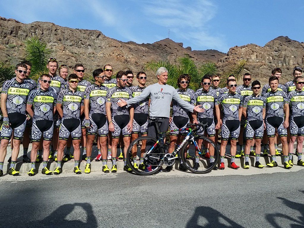 Oleg Tinkov poses with the Tinkoff-Saxo riders in their new training kit