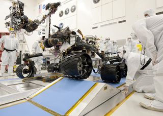 The Curiosity rover was tested under clean conditions on Earth before launch to prevent microbial stowaways.