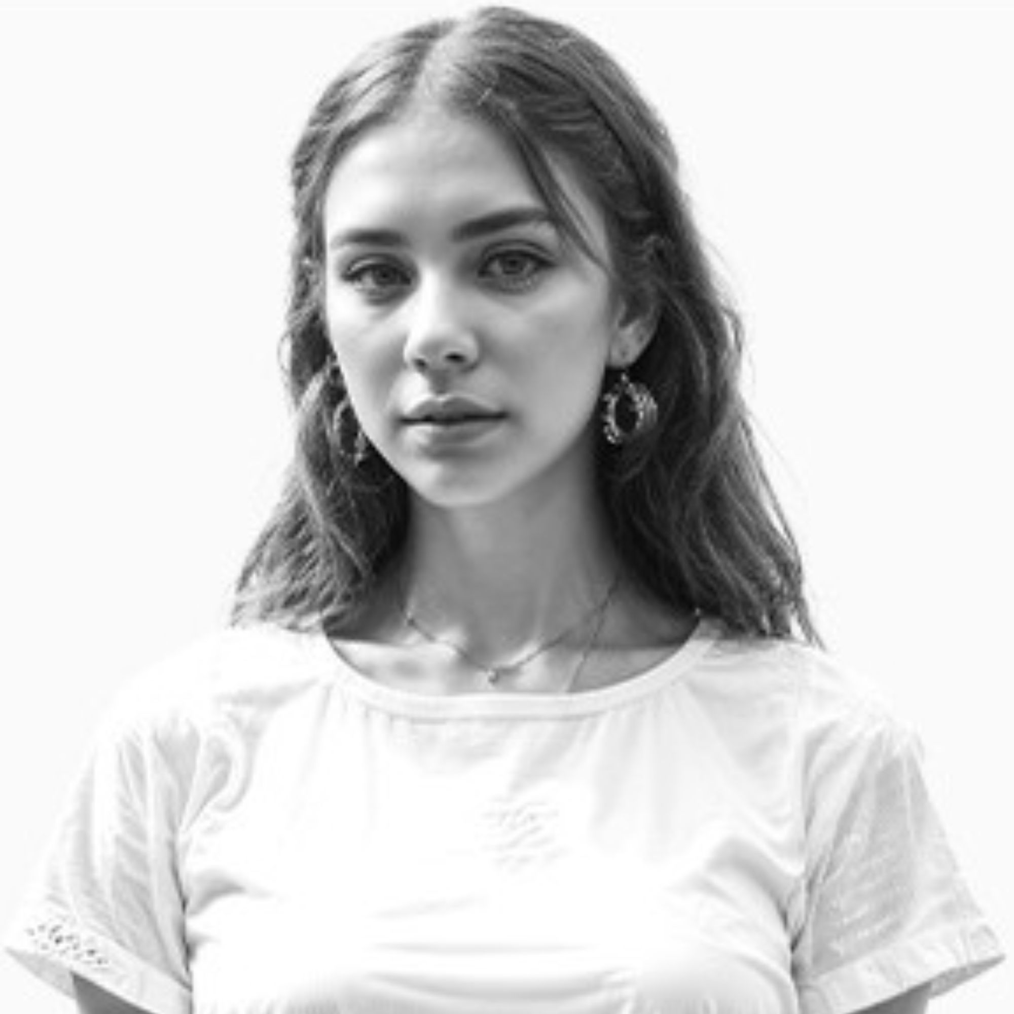 A black and white picture of Vera Lopez, a white woman wearing a white t-shirt