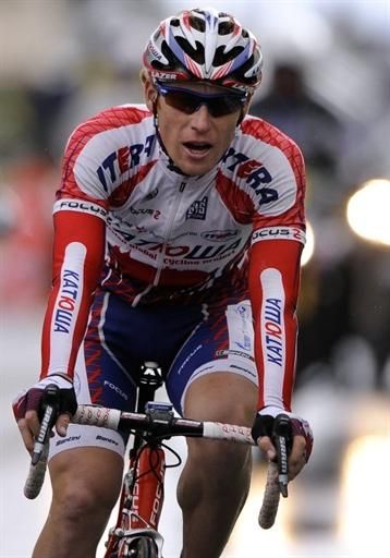 Pavel Brutt (Katusha) finishes alone to win a rainy, cold stage 1.