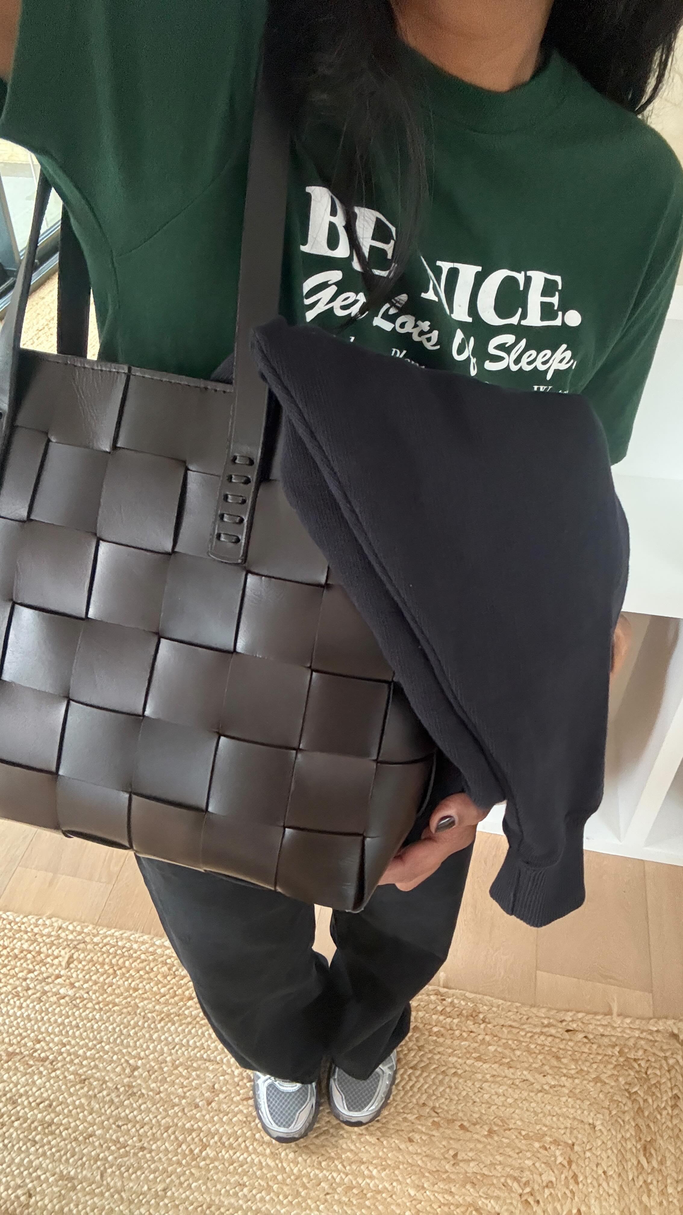 Monikh wears a woven leather basket bag