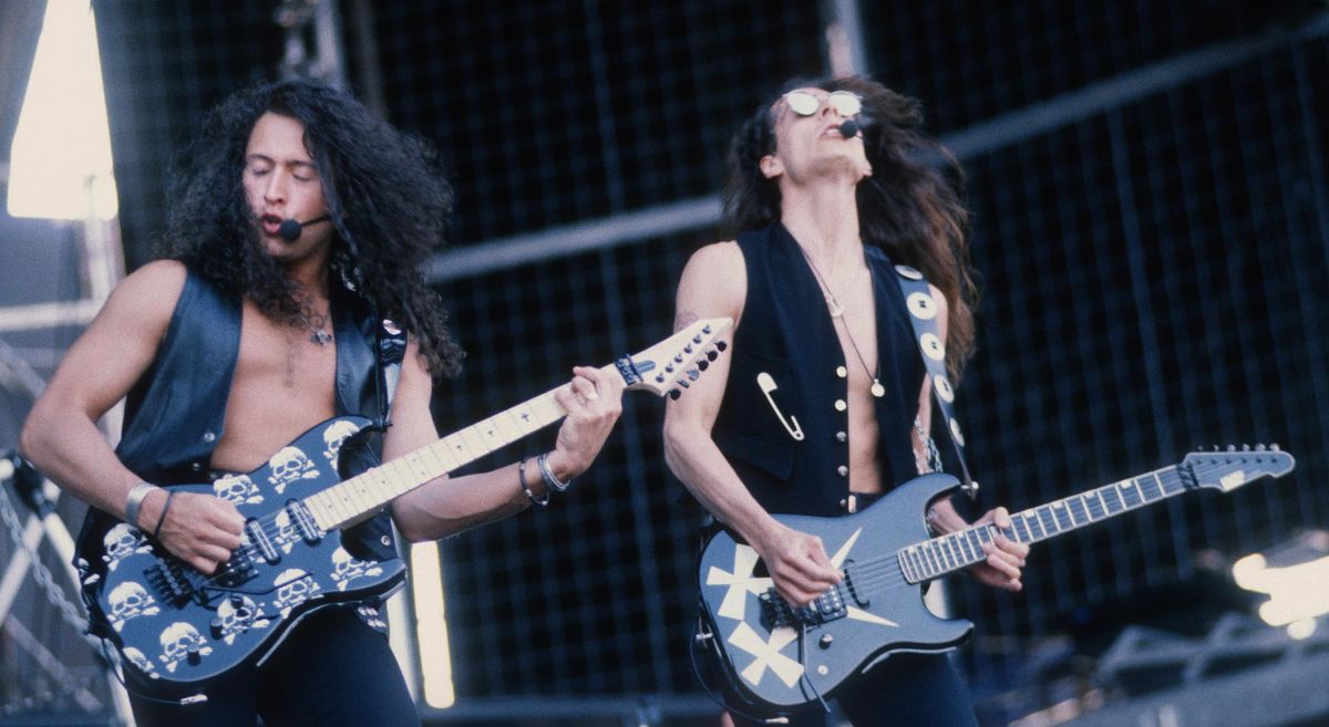 Michael Wilton and Chris DeGarmo of Queensrÿche play ESP S-styles live onstage during the 1991 Monsters of Rock Tour in Belgium. Check out the Britney-style mics.