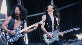 Michael Wilton and Chris DeGarmo of Queensrÿche play ESP S-styles live onstage during the 1991 Monsters of Rock Tour in Belgium. Check out the Britney-style mics.