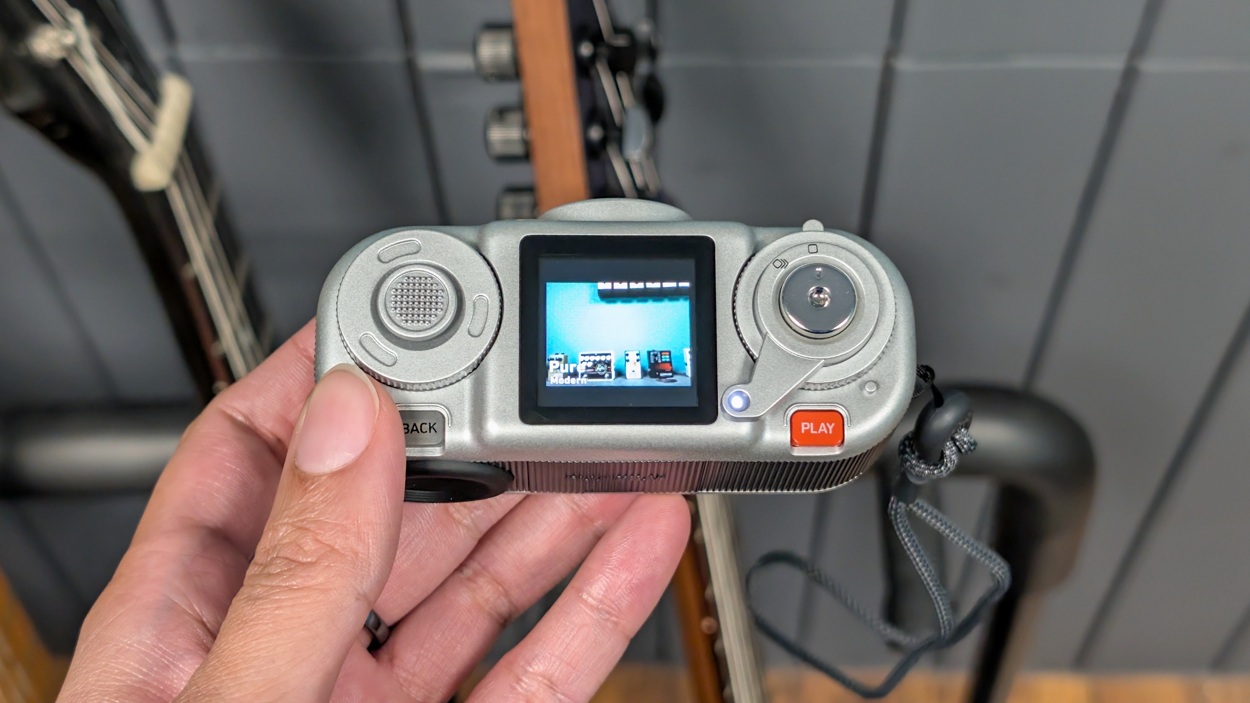 A black and silver Fujifilm Instax Pal 2 digital camera