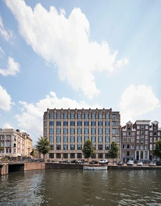 A view of soho house Amsterdam from the canal