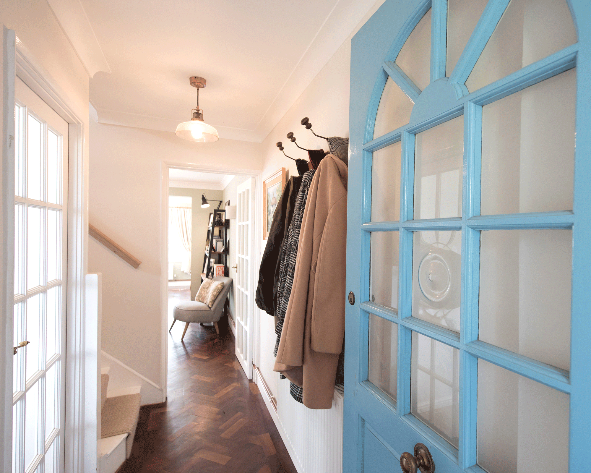 hallway with blue front door