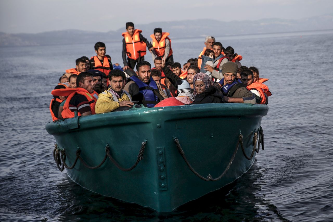 Syrian refugees packed into an overcrowded boat.