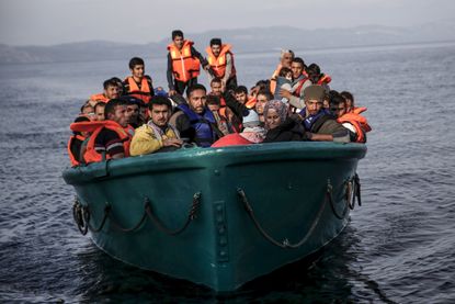 Syrian refugees packed into an overcrowded boat.