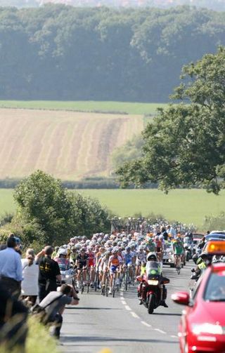 The peloton rides through the British countryside on stage one