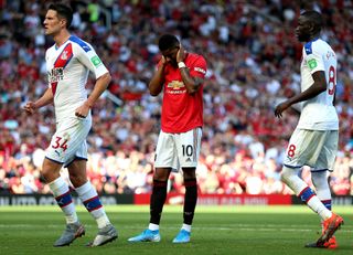 Marcus Rashford appears dejected after missing from the penalty spot