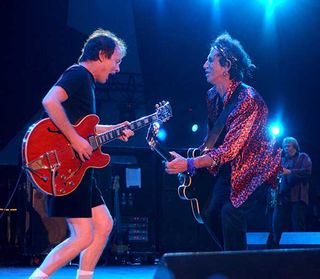 Angus Young of AC/DC and Keith Richards of the Rolling Stones