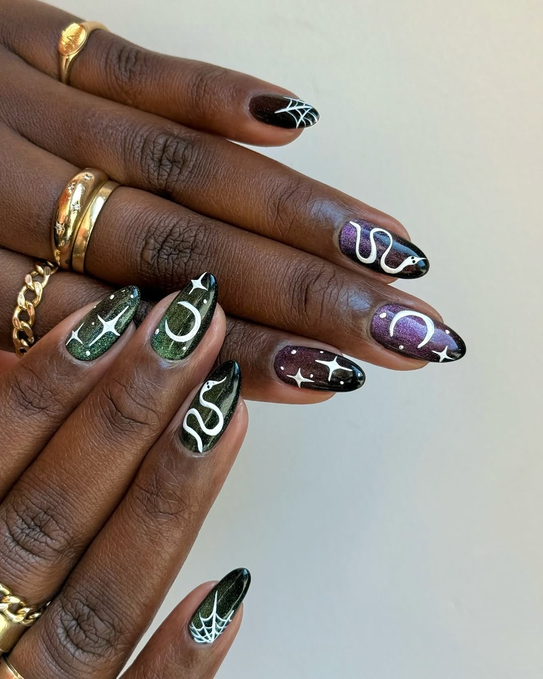 purple and green cat eye nails