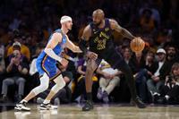 LeBron James #23 of the Los Angeles Lakers dribbles against Alex Caruso #9 of the Oklahoma City Thunder during the fourth quarter in Game Four of the Second Round of the NBA Western Conference Playoffs at Crypto.com Arena on May 11, 2026 in Los Angeles, California (Photo by Luke Hales/Getty Images)