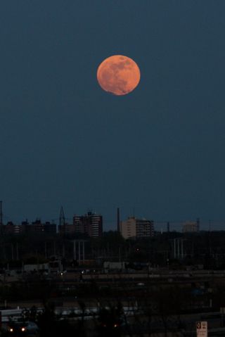 The supermoon of 2012 rises over Toronto, Ontario in Canada in this spectacular photo by skywatcher Reuben Opena taken on May 5, 2012 during the biggest full moon of the year.