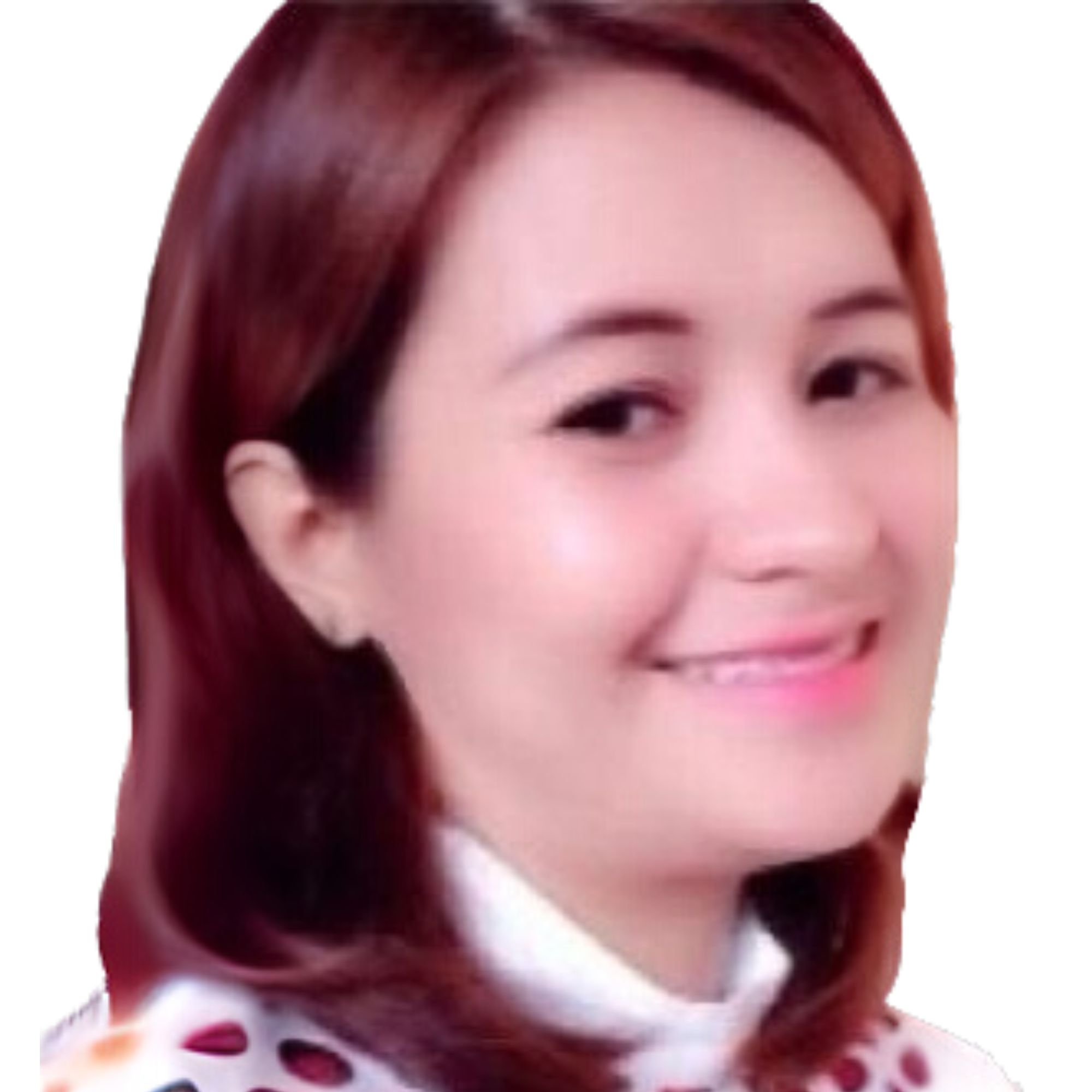 A headshot of Joy Ramos - a woman with red hair smiling into the camera