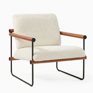 A Ross Chair, a chair with a boucle seat and back, wooden arms, and thin metal frame