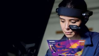 Woman wearing RealWear Navigator 500 headset fitted with infrared camera